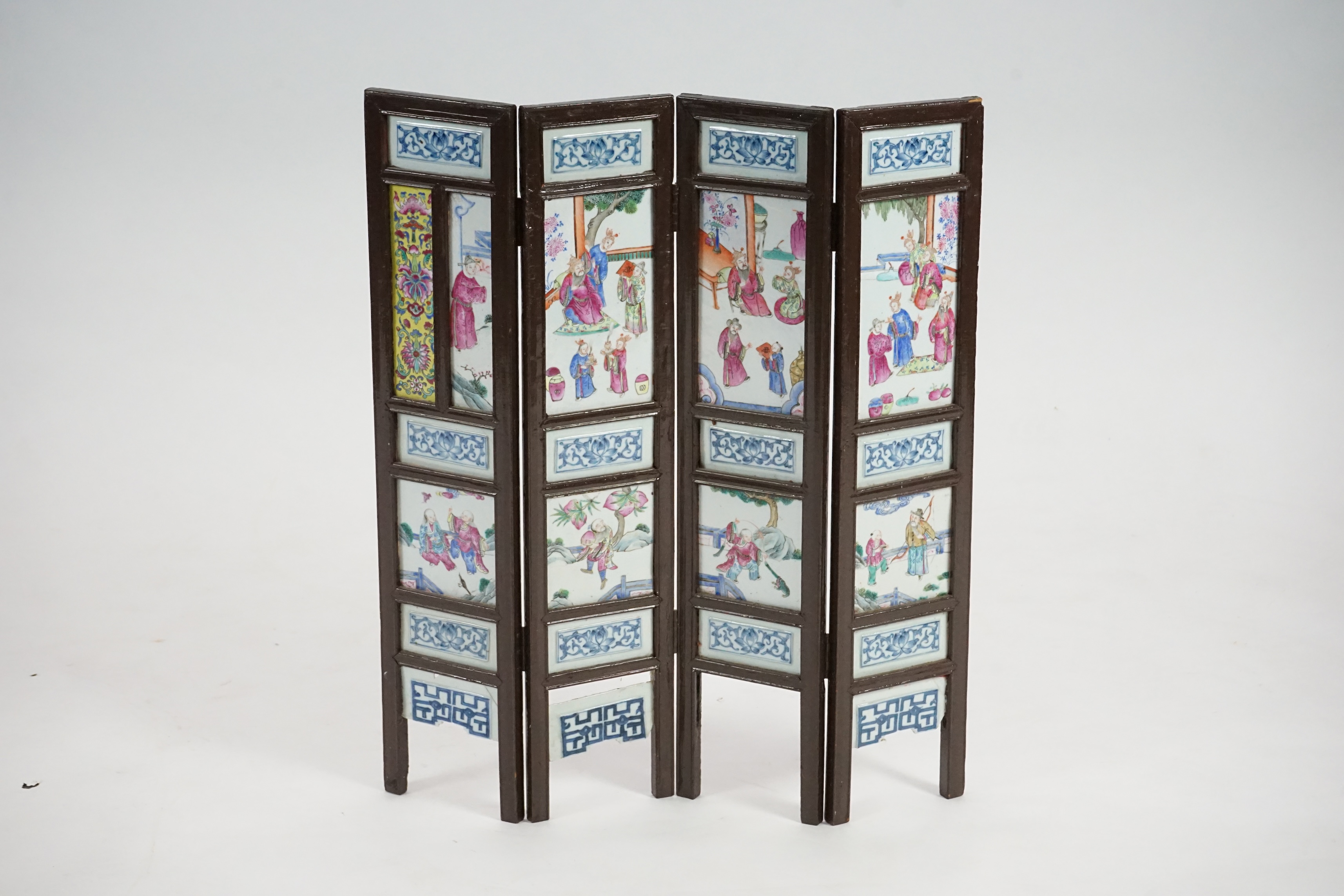 A Chinese wood framed and porcelain mounted low screen, late 19th century